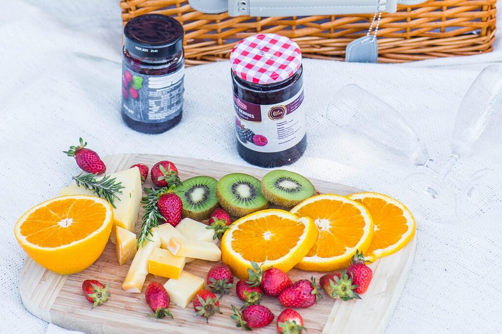 picnic, fruit, basket, flowers, bottle, table setup, dinner, plates, decor, wine glass, outdoor, flower background, picnic basket, cutlery, meal, beautiful flowers, flower wallpaper, nature, lunch, food